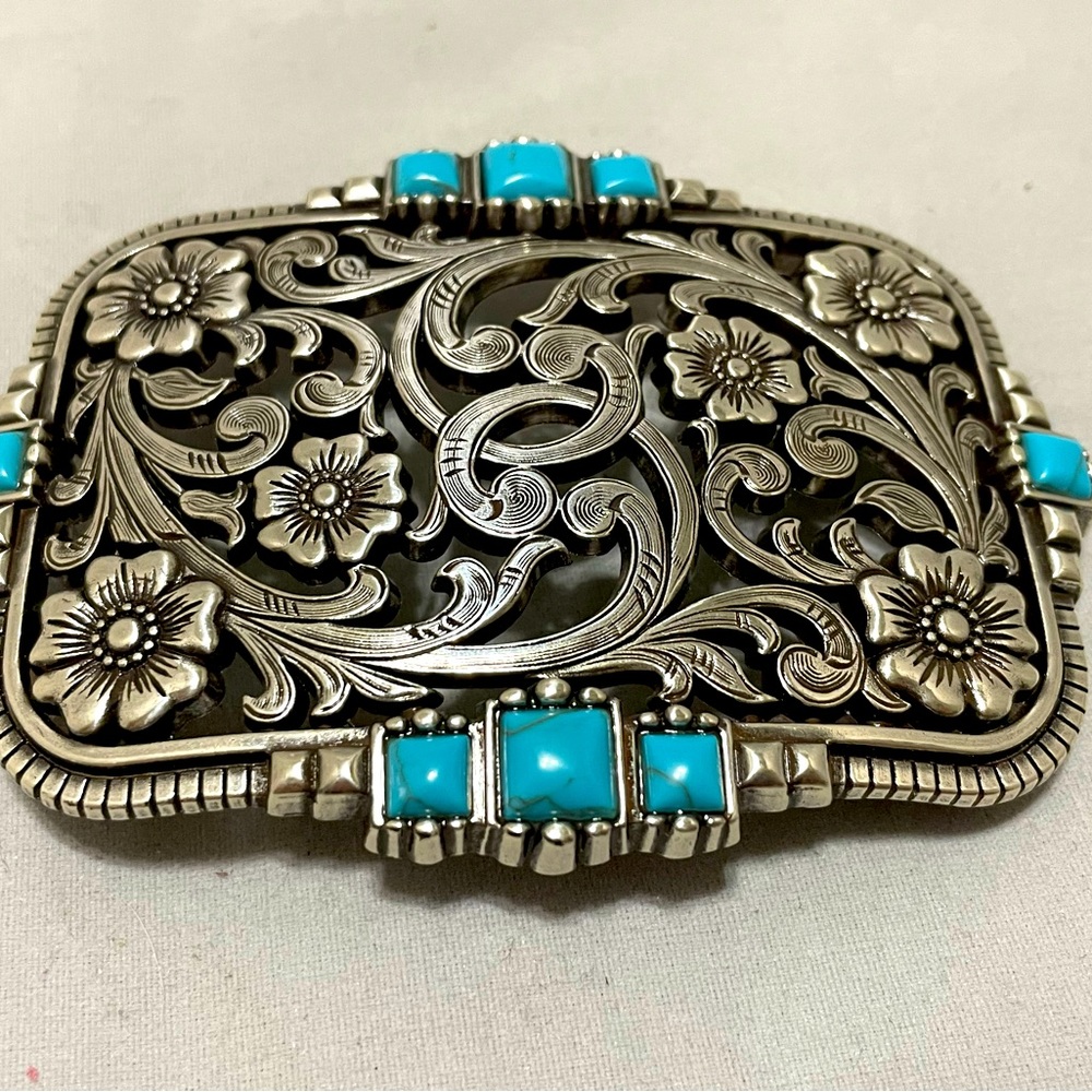 This is a Chrome, Reconstituted Turquoise Belt Buckle.